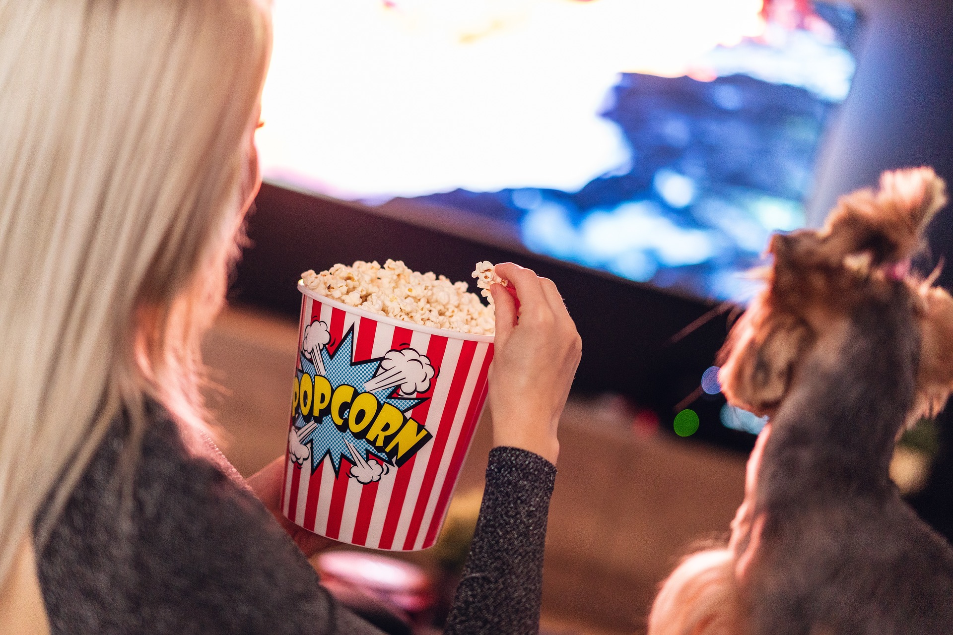 Woman & Dog Watching TV with popcorn