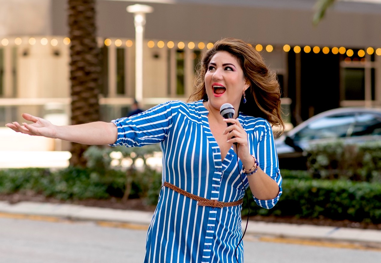 TV show host - woman speaking on street